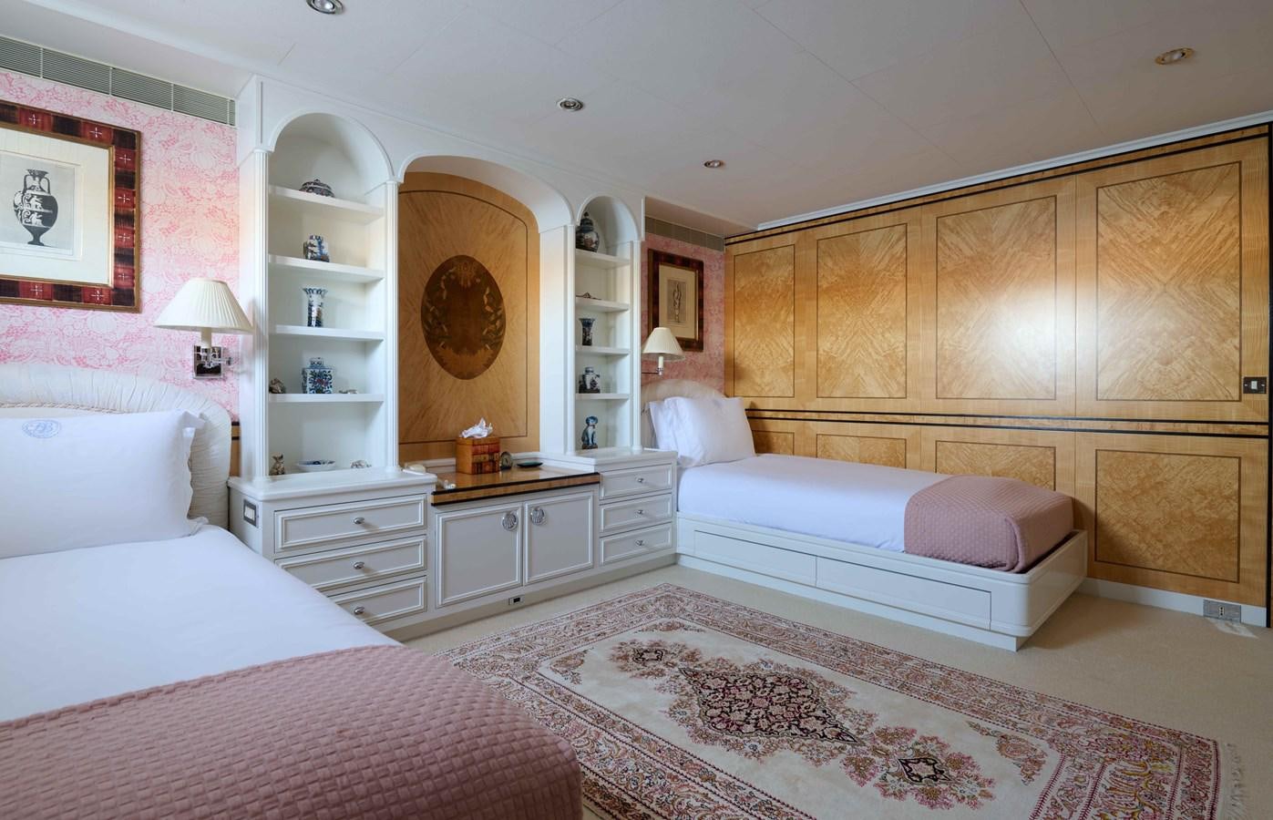 a room with a bed and a mirror aboard LADY BEATRICE Yacht for Sale
