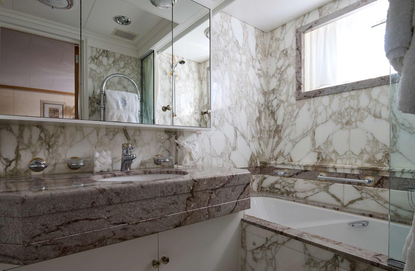 a bathroom with a marble countertop aboard LADY BEATRICE Yacht for Sale