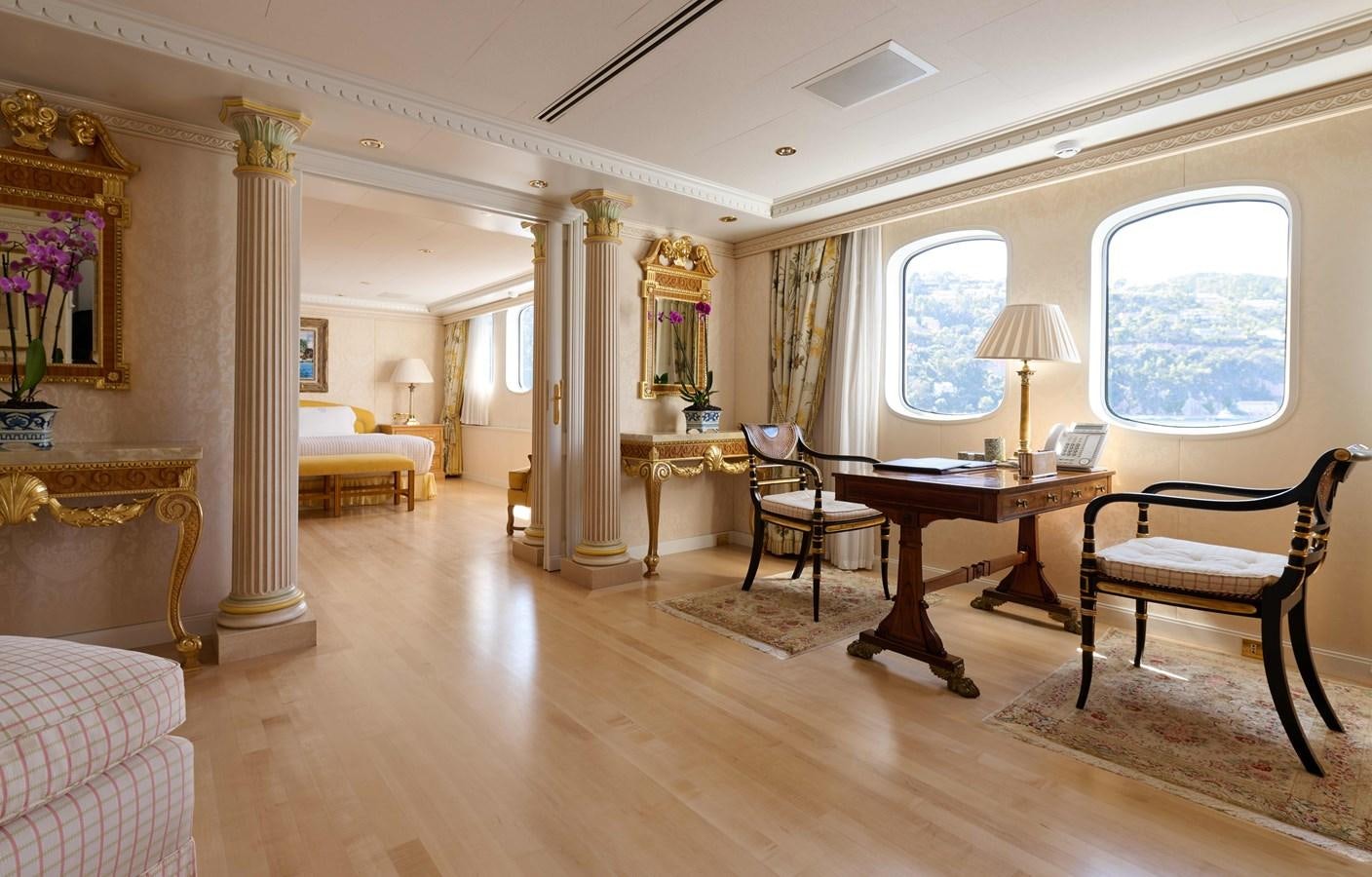 a large room with a table and chairs aboard LADY BEATRICE Yacht for Sale