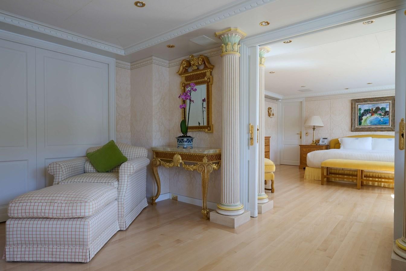 a room with a bed and a table aboard LADY BEATRICE Yacht for Sale