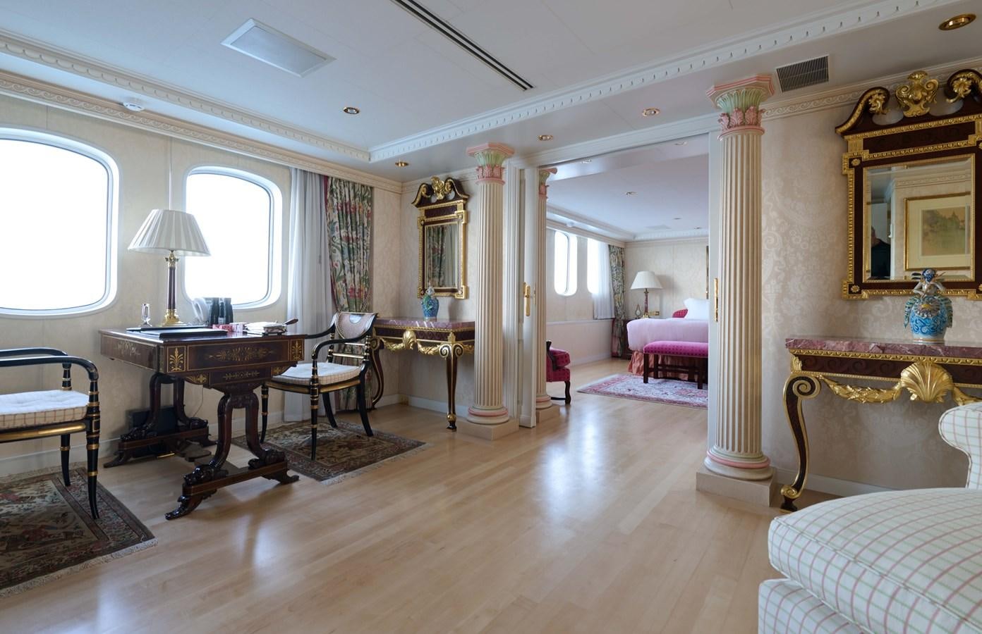 a large room with a table and chairs aboard LADY BEATRICE Yacht for Sale