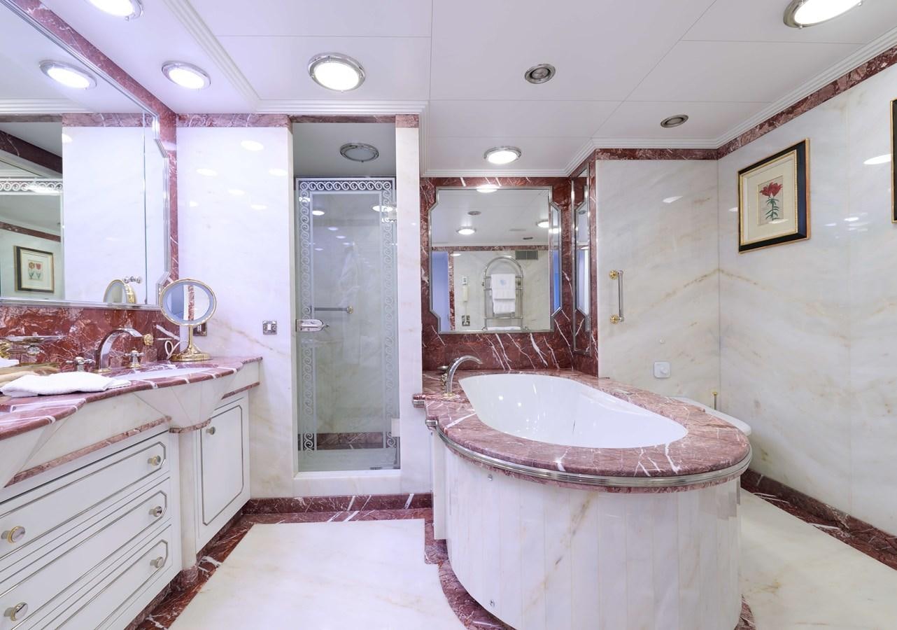 a bathroom with a large pink tub aboard LADY BEATRICE Yacht for Sale