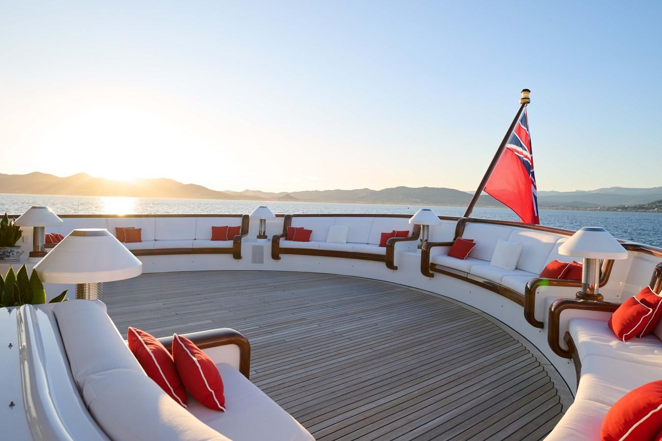a deck with chairs and umbrellas aboard LADY BEATRICE Yacht for Sale