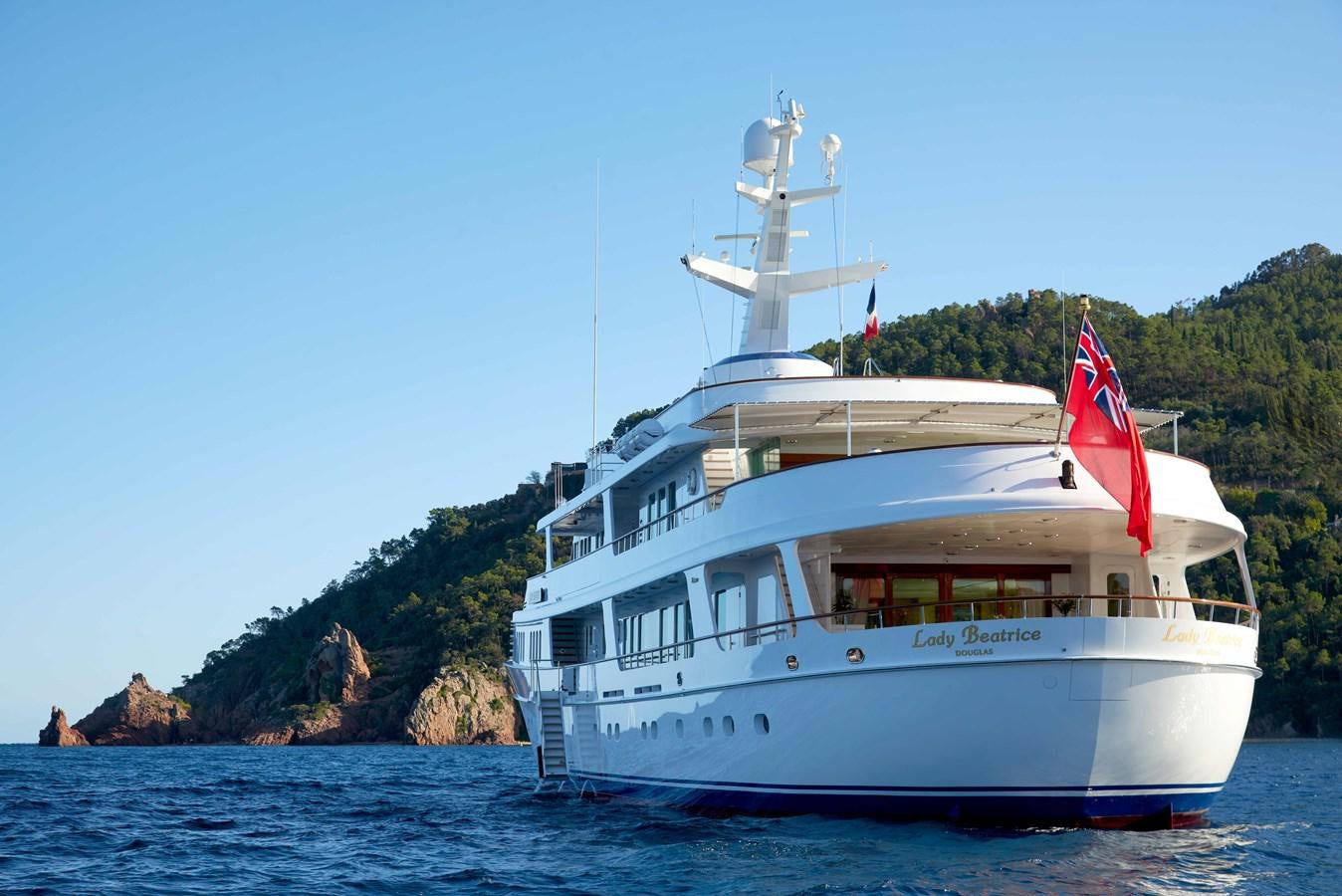 a large white boat on the water aboard LADY BEATRICE Yacht for Sale