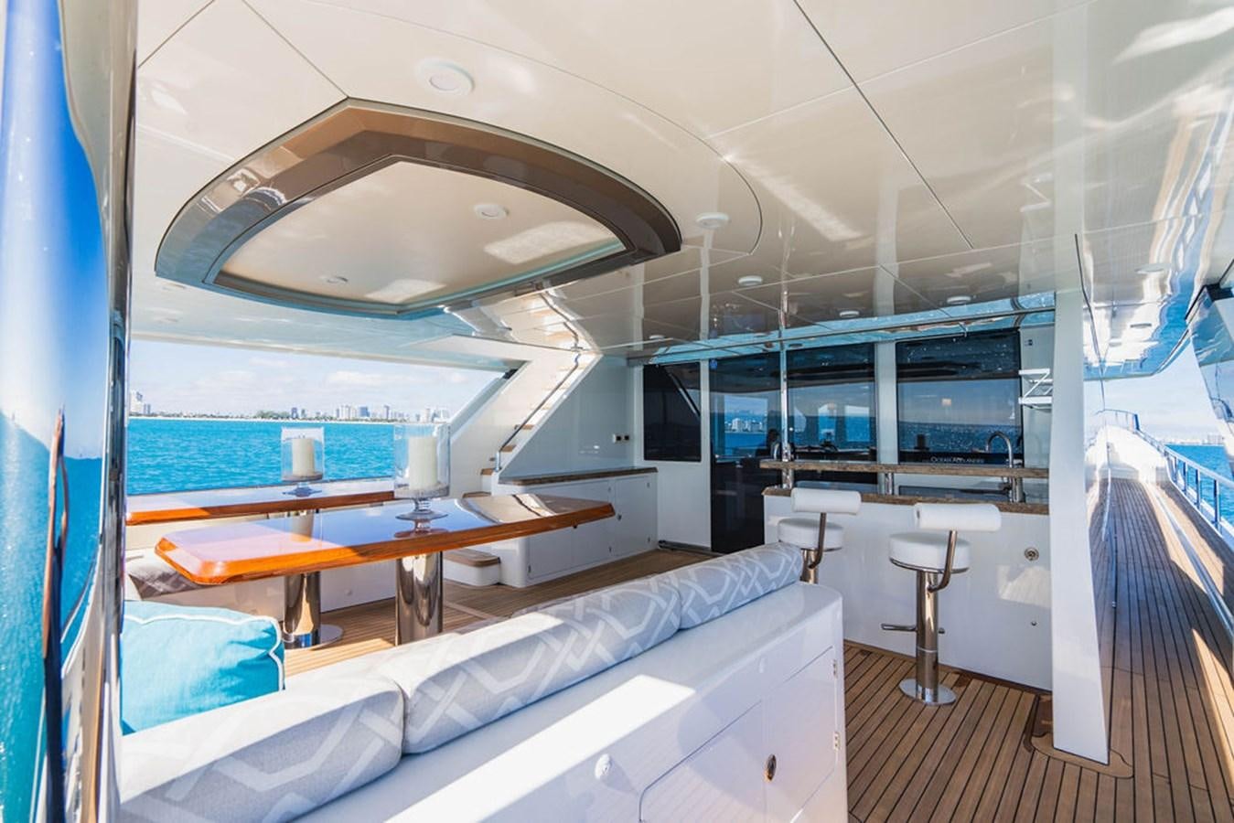 a room with a large bed and a table aboard FAR NIENTE Yacht for Sale