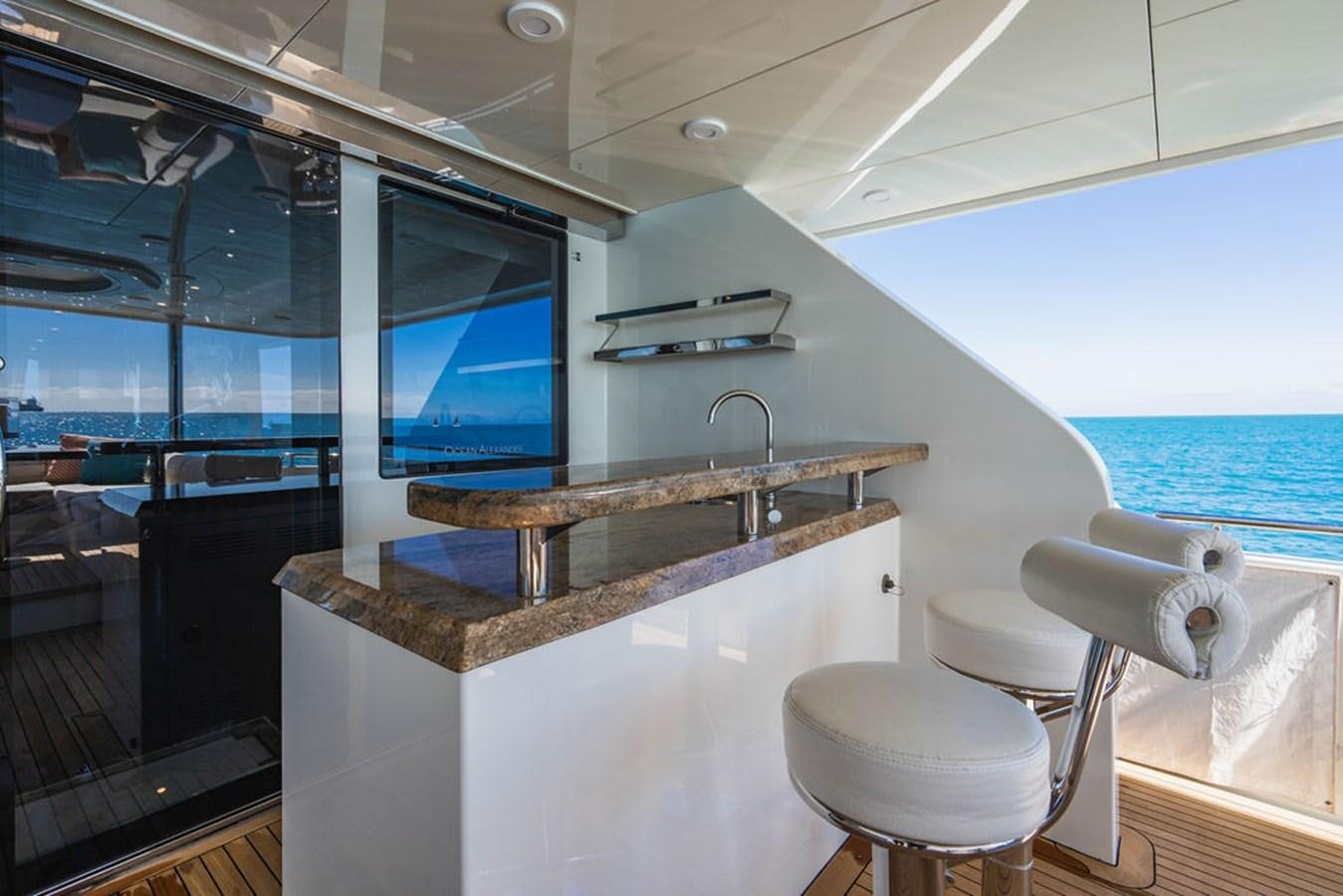 a kitchen with a large island aboard FAR NIENTE Yacht for Sale