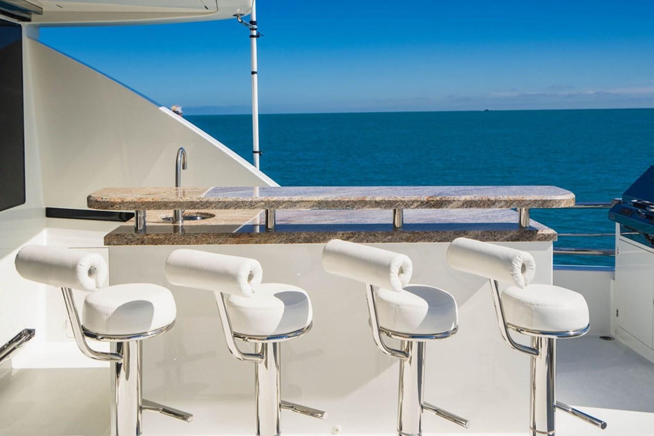 a group of white chairs on a boat aboard FAR NIENTE Yacht for Sale