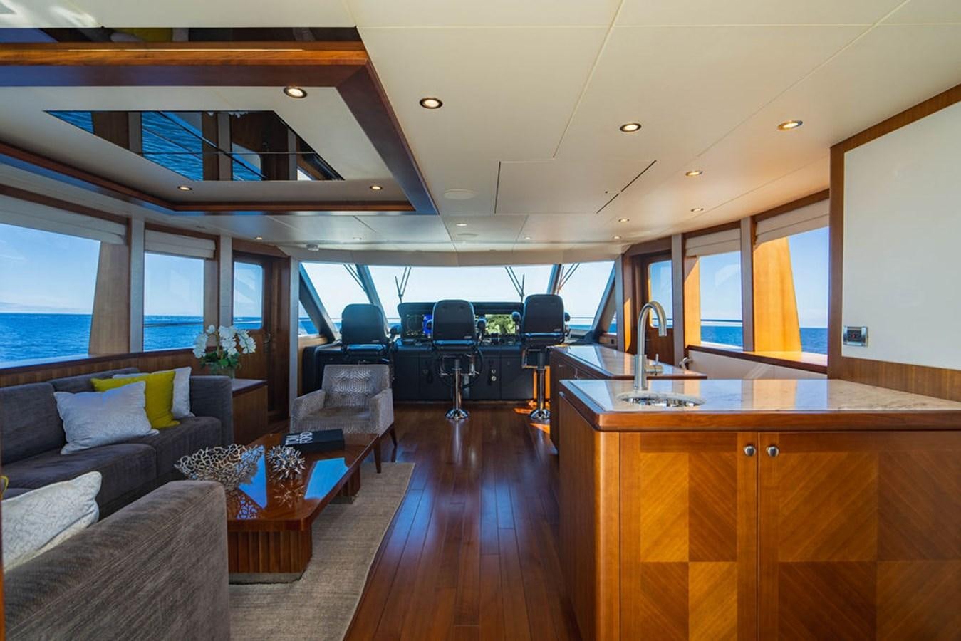 a room with a couch and a table and a window aboard FAR NIENTE Yacht for Sale