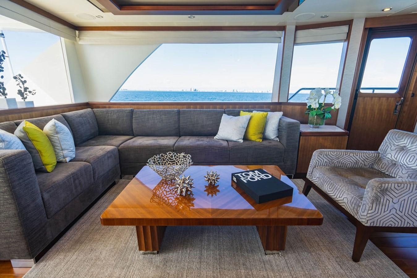 a living room with a couch and a coffee table aboard FAR NIENTE Yacht for Sale