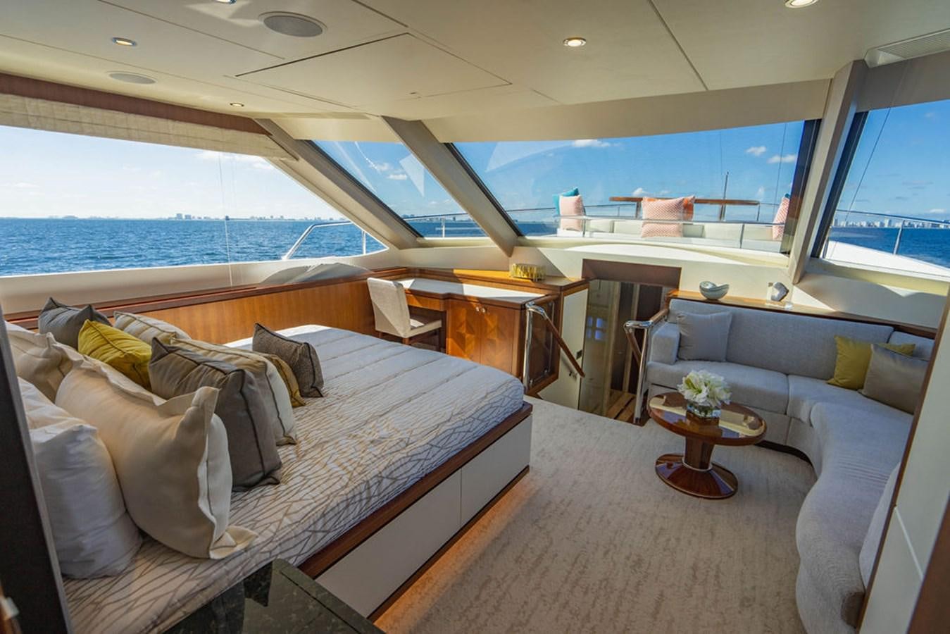 a room with a bed and a couch aboard FAR NIENTE Yacht for Sale