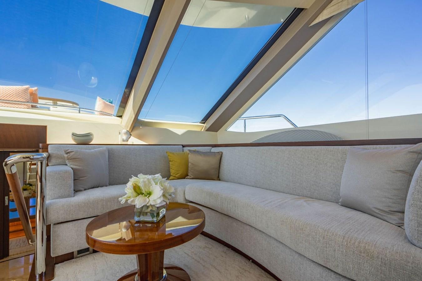a couch with a table in front of it aboard FAR NIENTE Yacht for Sale