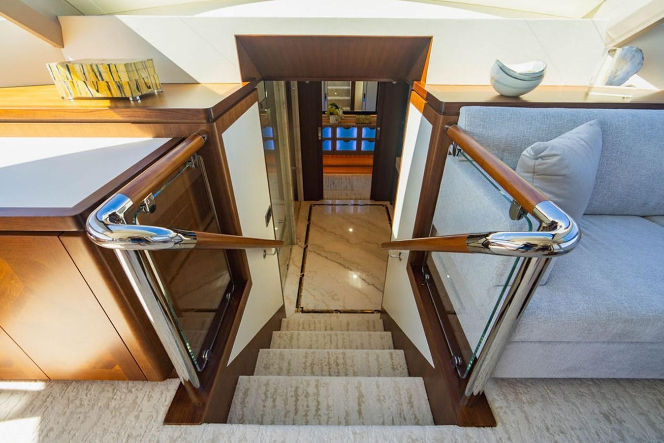 a room with a bed and a staircase aboard FAR NIENTE Yacht for Sale