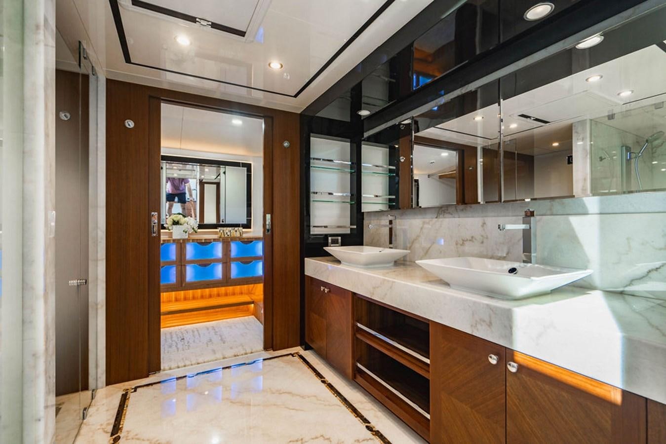 a bathroom with a sink and a mirror aboard FAR NIENTE Yacht for Sale