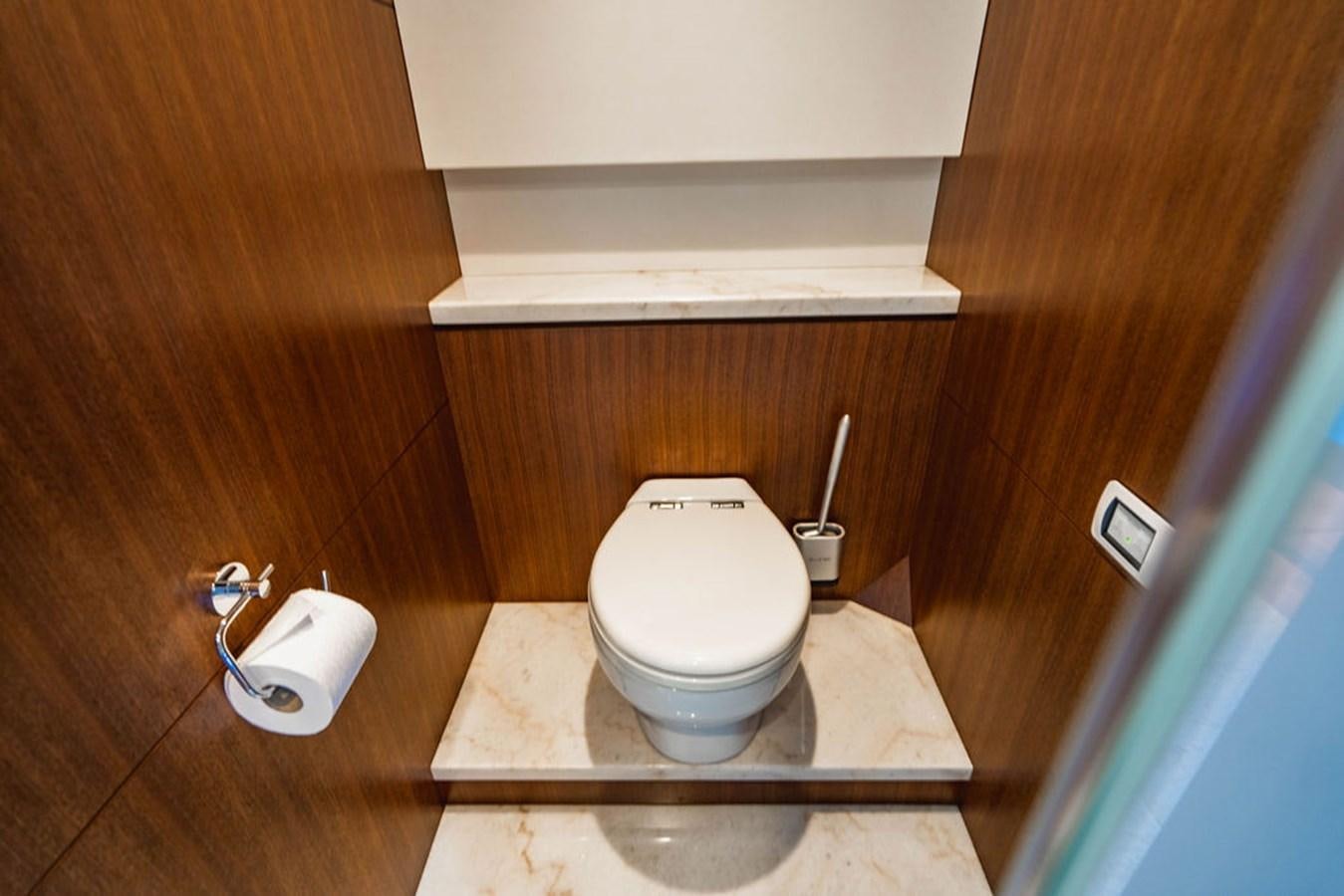 a toilet in a wooden room aboard FAR NIENTE Yacht for Sale