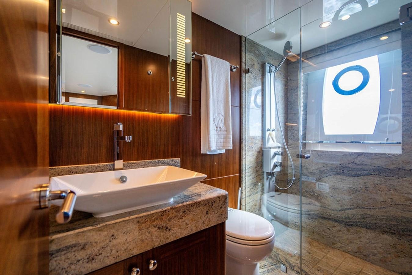 a bathroom with a glass shower aboard FAR NIENTE Yacht for Sale