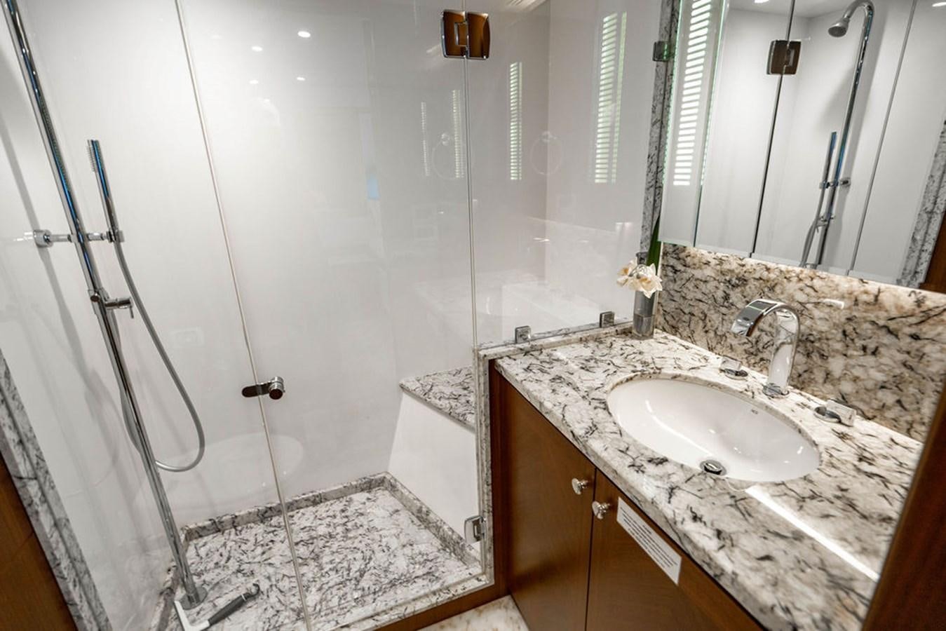 a bathroom with a sink and a shower aboard FAR NIENTE Yacht for Sale