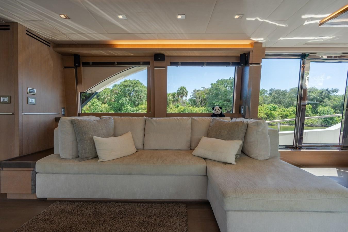 a couch in a room aboard PANDA Yacht for Sale