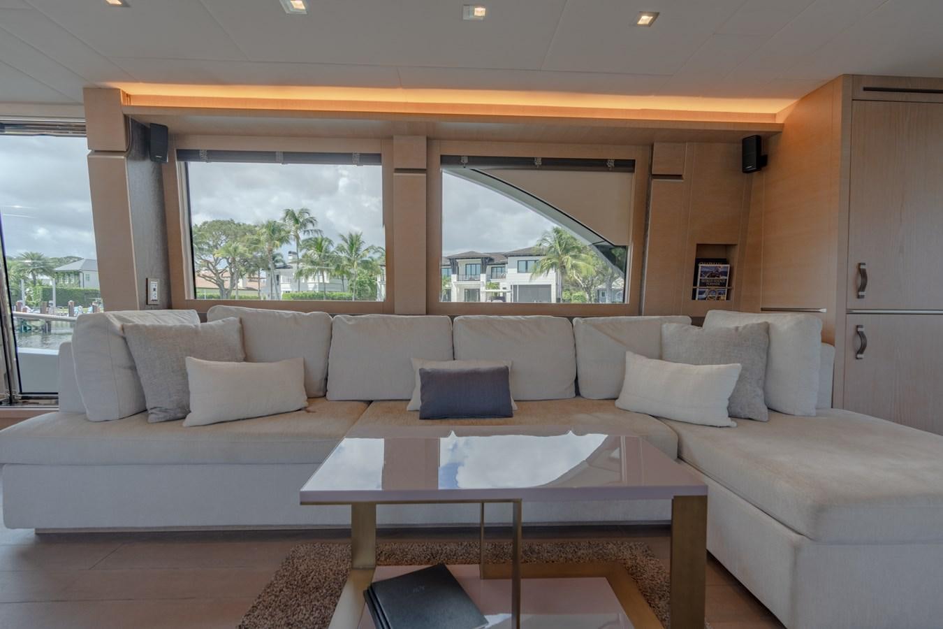 a living room with a couch and a table aboard PANDA Yacht for Sale