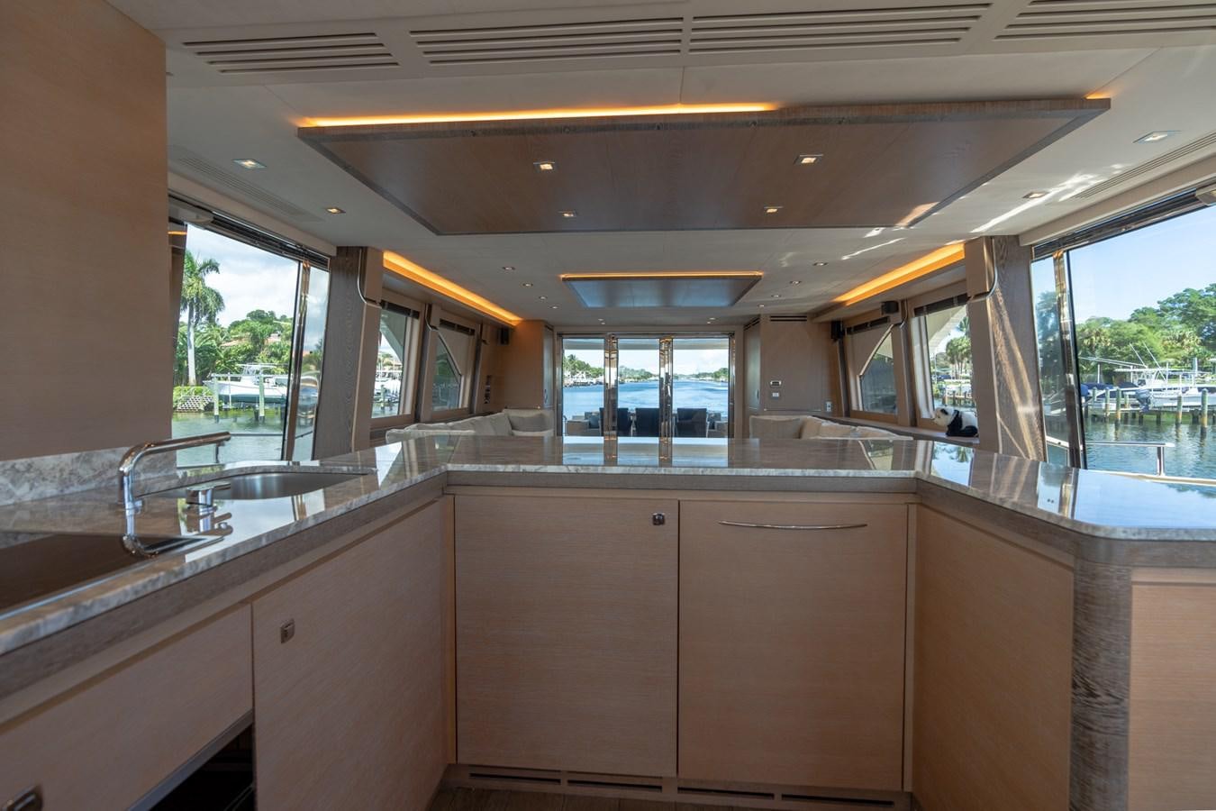 a kitchen with a sink and cabinets aboard PANDA Yacht for Sale