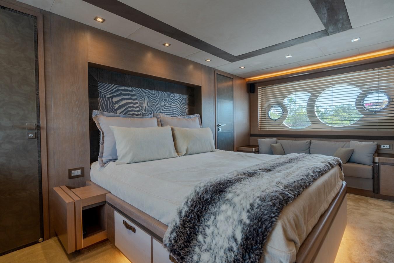 a large bed in a room aboard PANDA Yacht for Sale