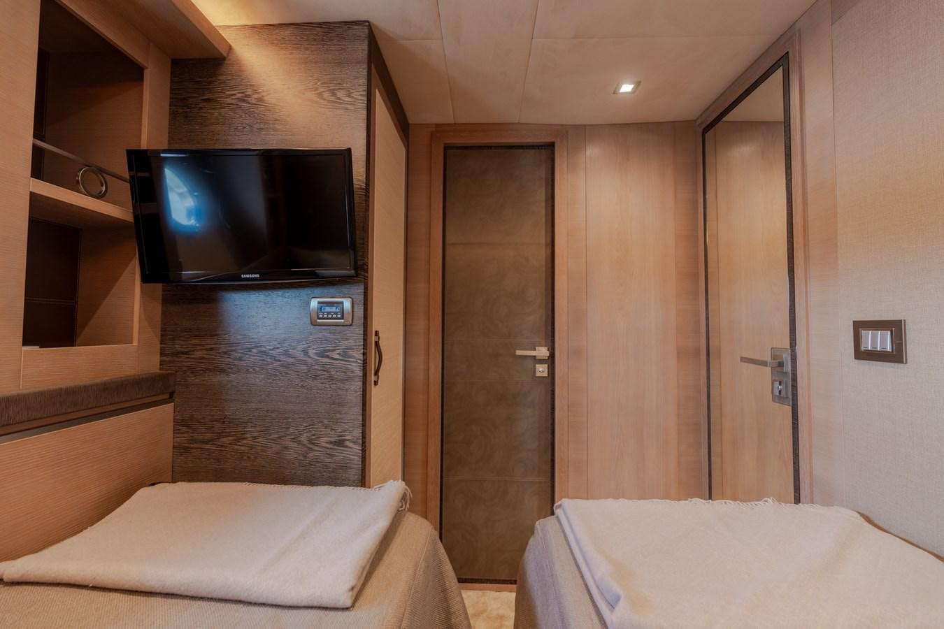 a hotel room with a tv aboard PANDA Yacht for Sale
