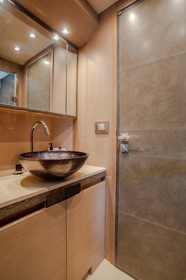 a bathroom with a sink and a shower aboard PANDA Yacht for Sale
