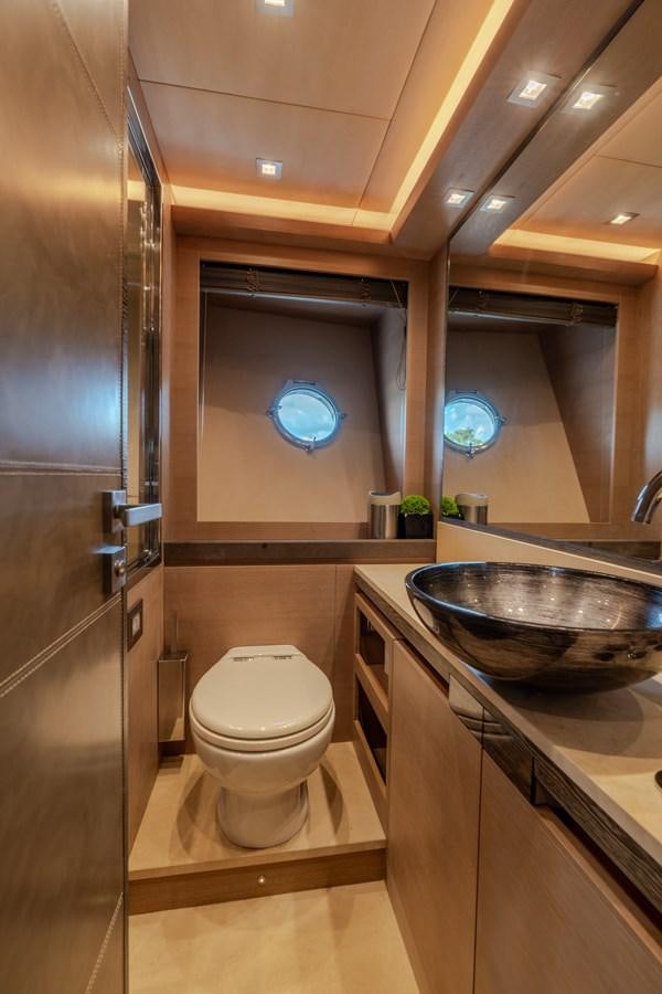 a bathroom with a sink and a toilet aboard PANDA Yacht for Sale