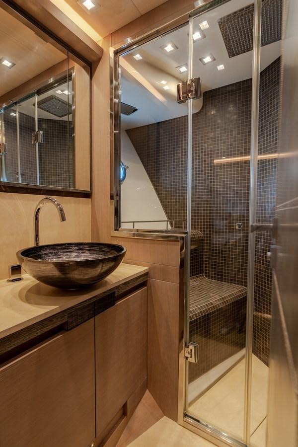 a bathroom with a glass shower aboard PANDA Yacht for Sale