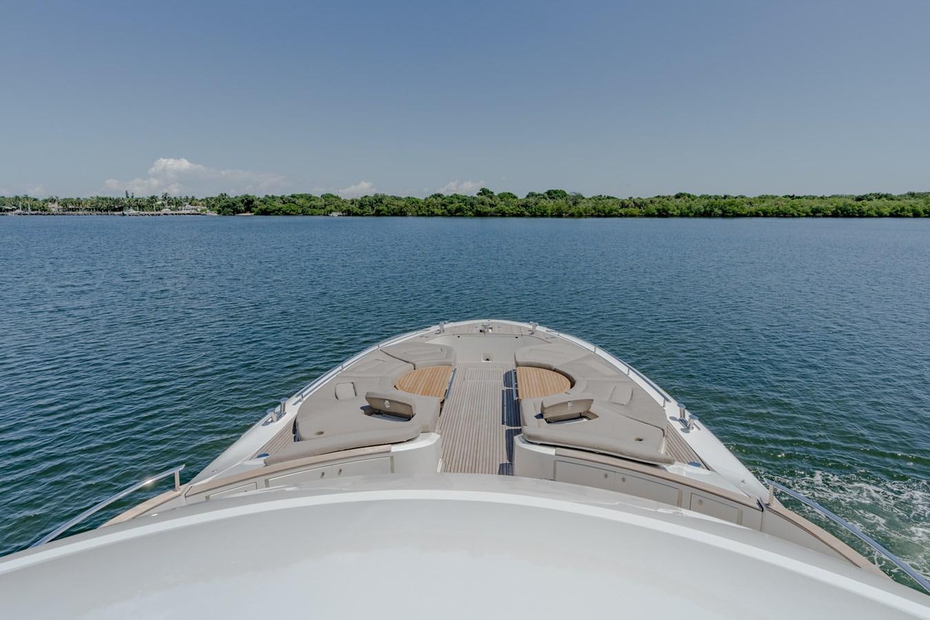 a white boat on the water aboard PANDA Yacht for Sale