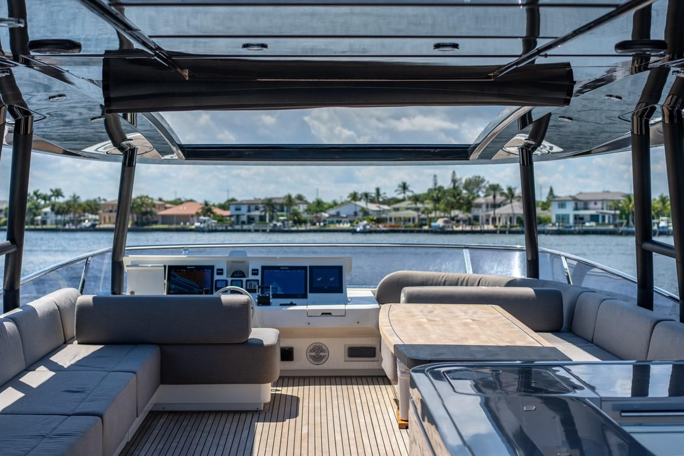 a room with a view of a city and water aboard PANDA Yacht for Sale