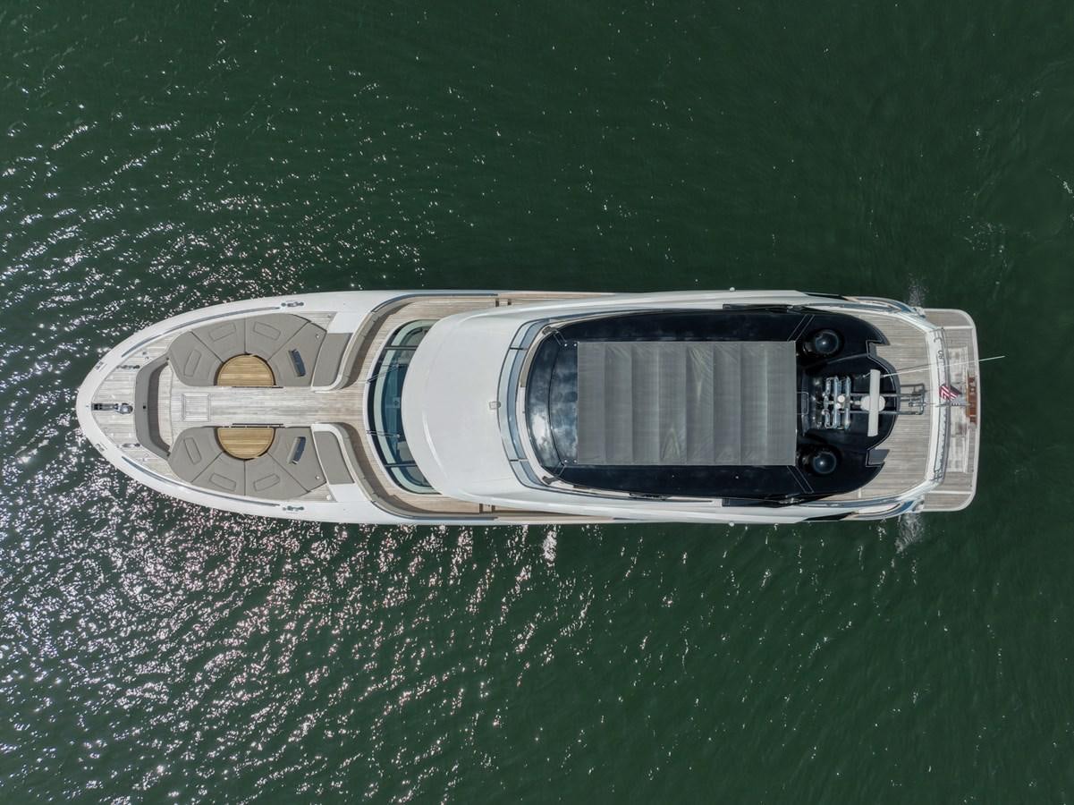 a silver car with a black stripe on a green surface aboard PANDA Yacht for Sale