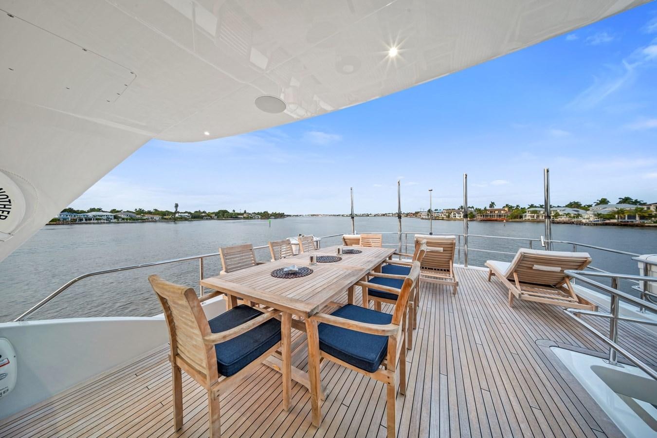 a table and chairs on a deck aboard ANOTHER IMPULSIVE DECISION Yacht for Sale