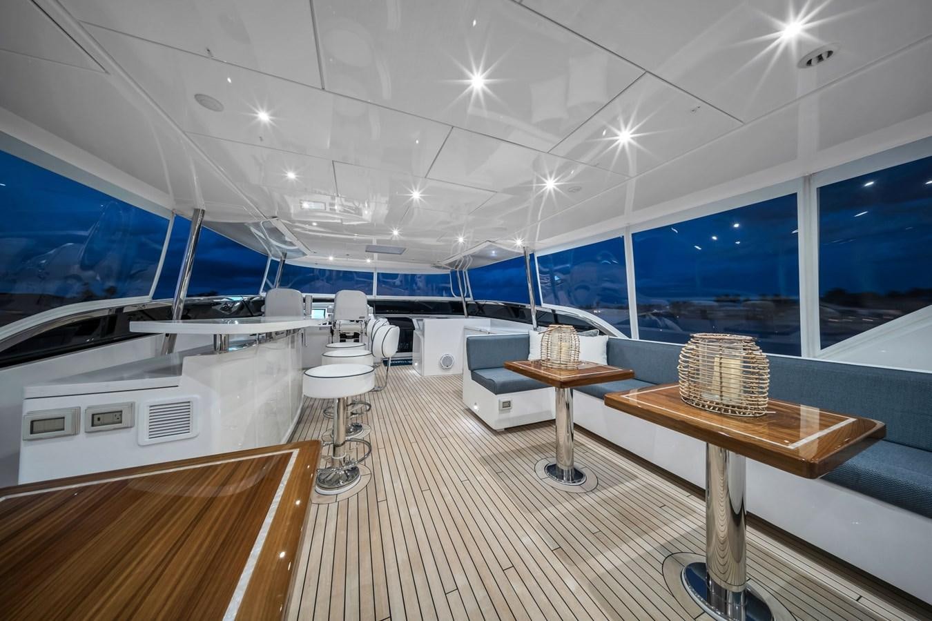 a room with tables and chairs aboard ANOTHER IMPULSIVE DECISION Yacht for Sale