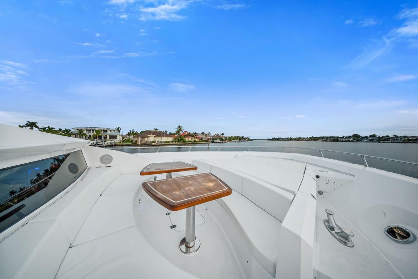 a wooden chair on a deck of a boat on a body of water aboard ANOTHER IMPULSIVE DECISION Yacht for Sale