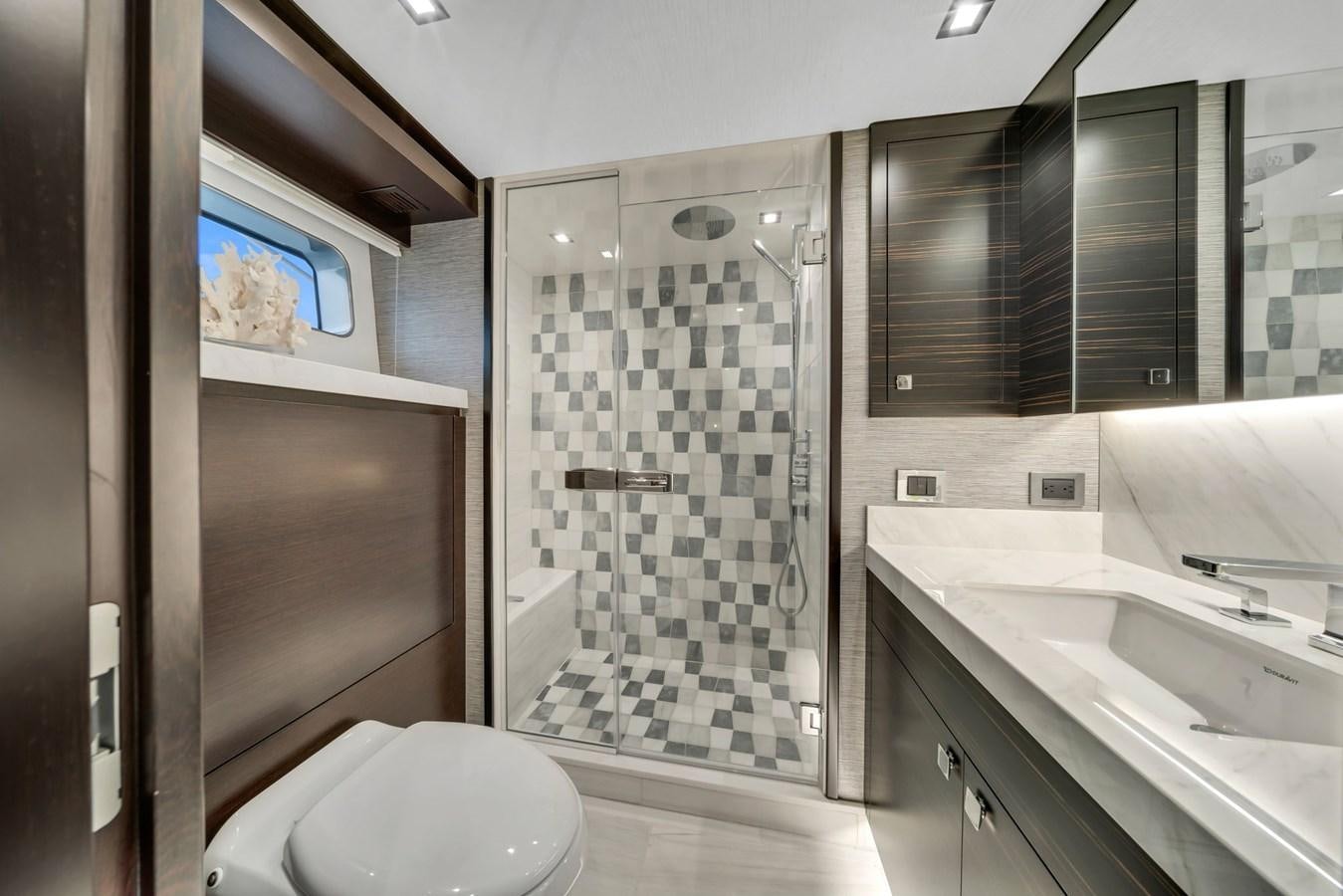 a bathroom with a glass shower aboard ANOTHER IMPULSIVE DECISION Yacht for Sale