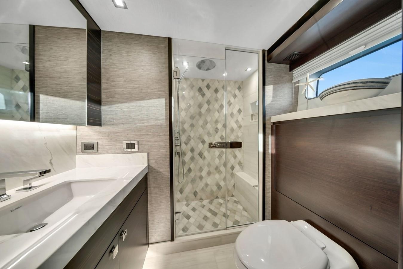 a bathroom with a glass shower aboard ANOTHER IMPULSIVE DECISION Yacht for Sale
