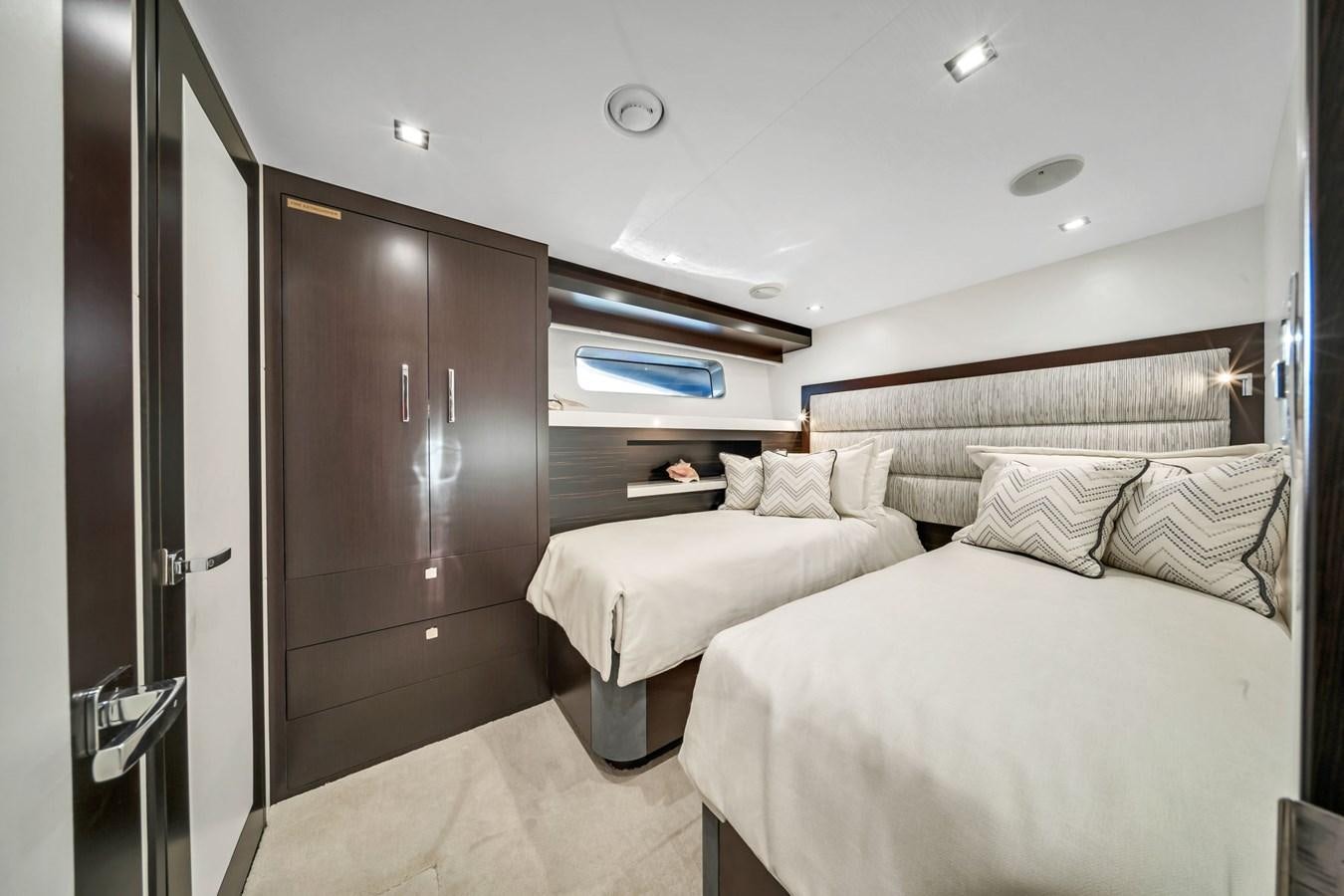 a room with a bed and a closet aboard ANOTHER IMPULSIVE DECISION Yacht for Sale
