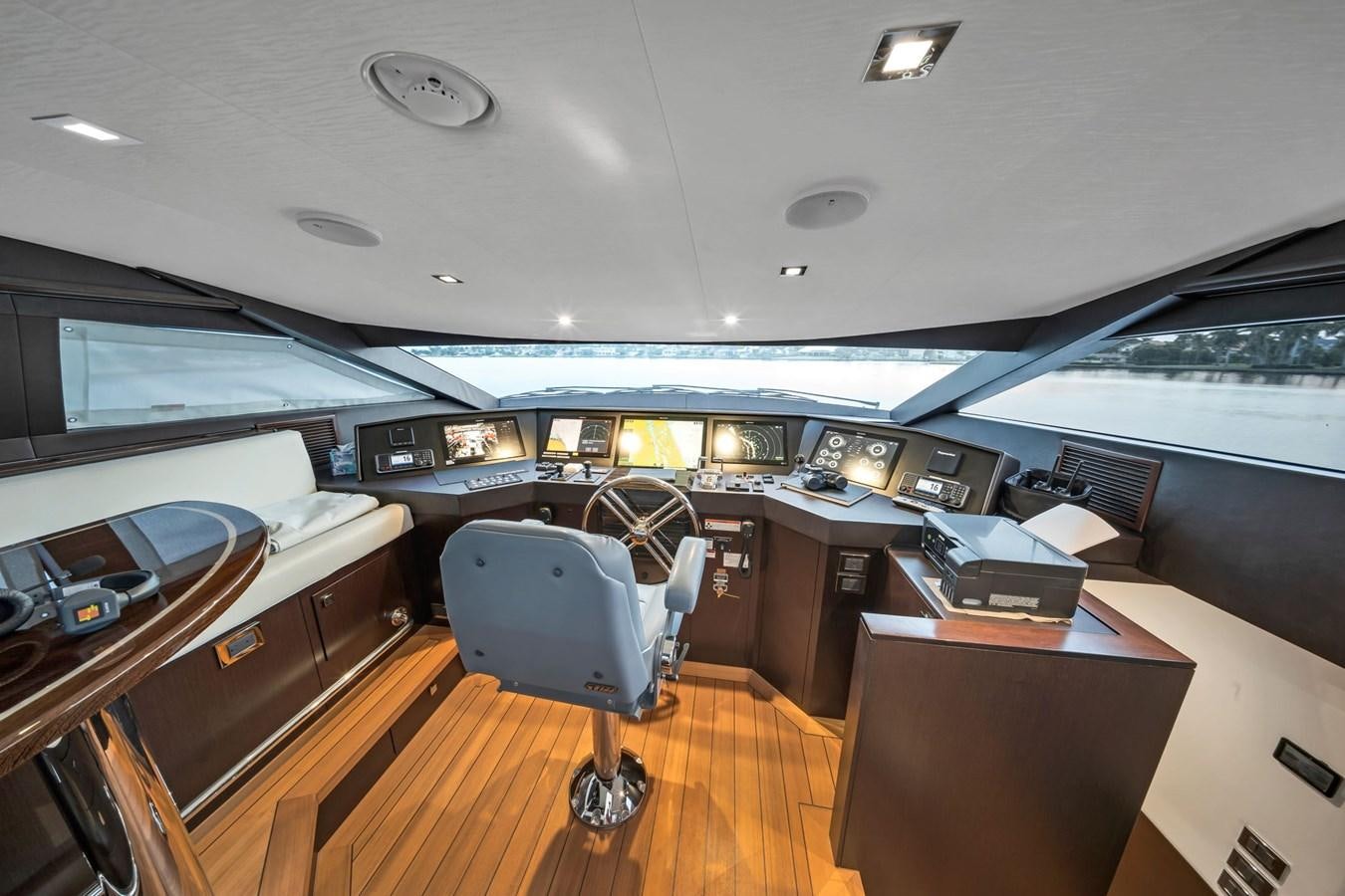an airplane cockpit with a desk and chairs aboard ANOTHER IMPULSIVE DECISION Yacht for Sale