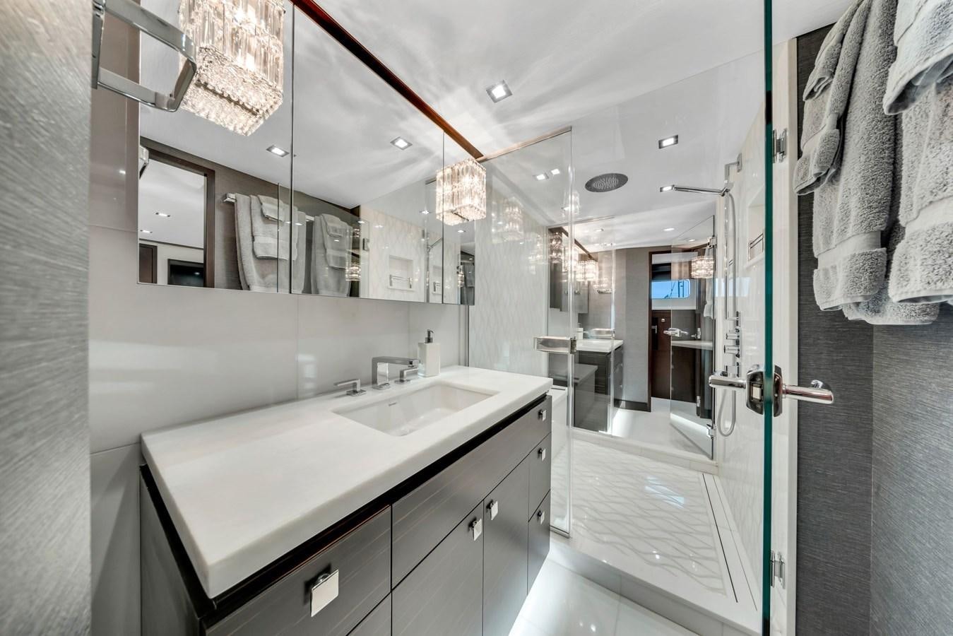 a bathroom with a countertop sink and mirror aboard ANOTHER IMPULSIVE DECISION Yacht for Sale