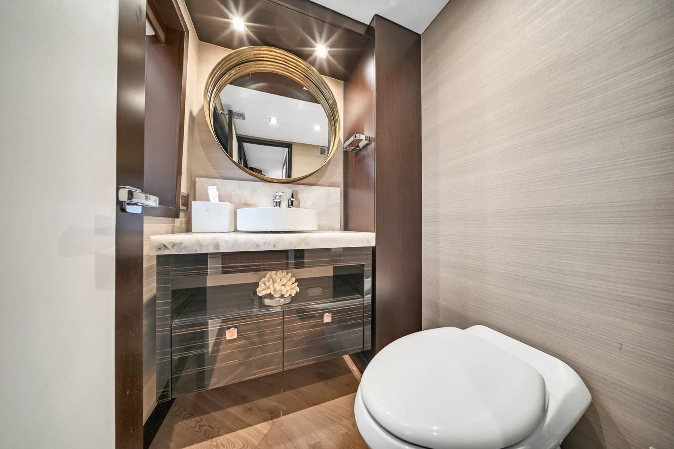 a bathroom with a mirror and a toilet aboard ANOTHER IMPULSIVE DECISION Yacht for Sale