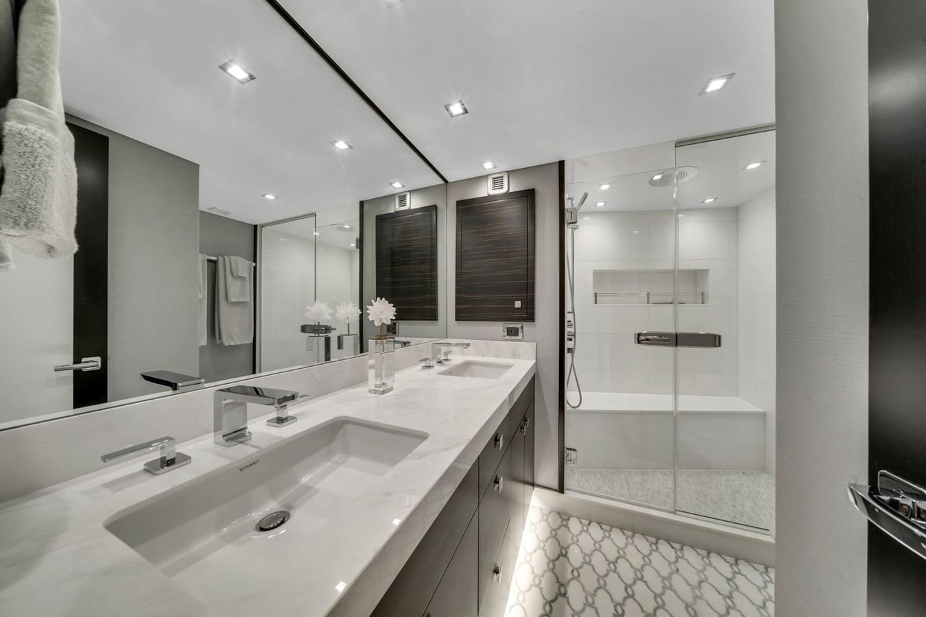 a bathroom with a large mirror aboard ANOTHER IMPULSIVE DECISION Yacht for Sale