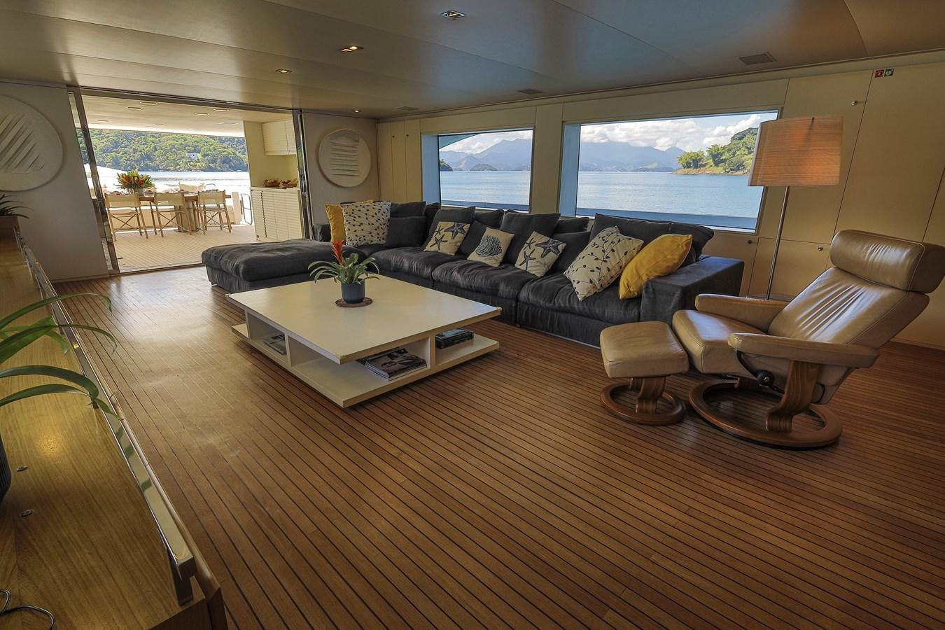 a living room with a large window aboard PAPA-GOLFE Yacht for Sale