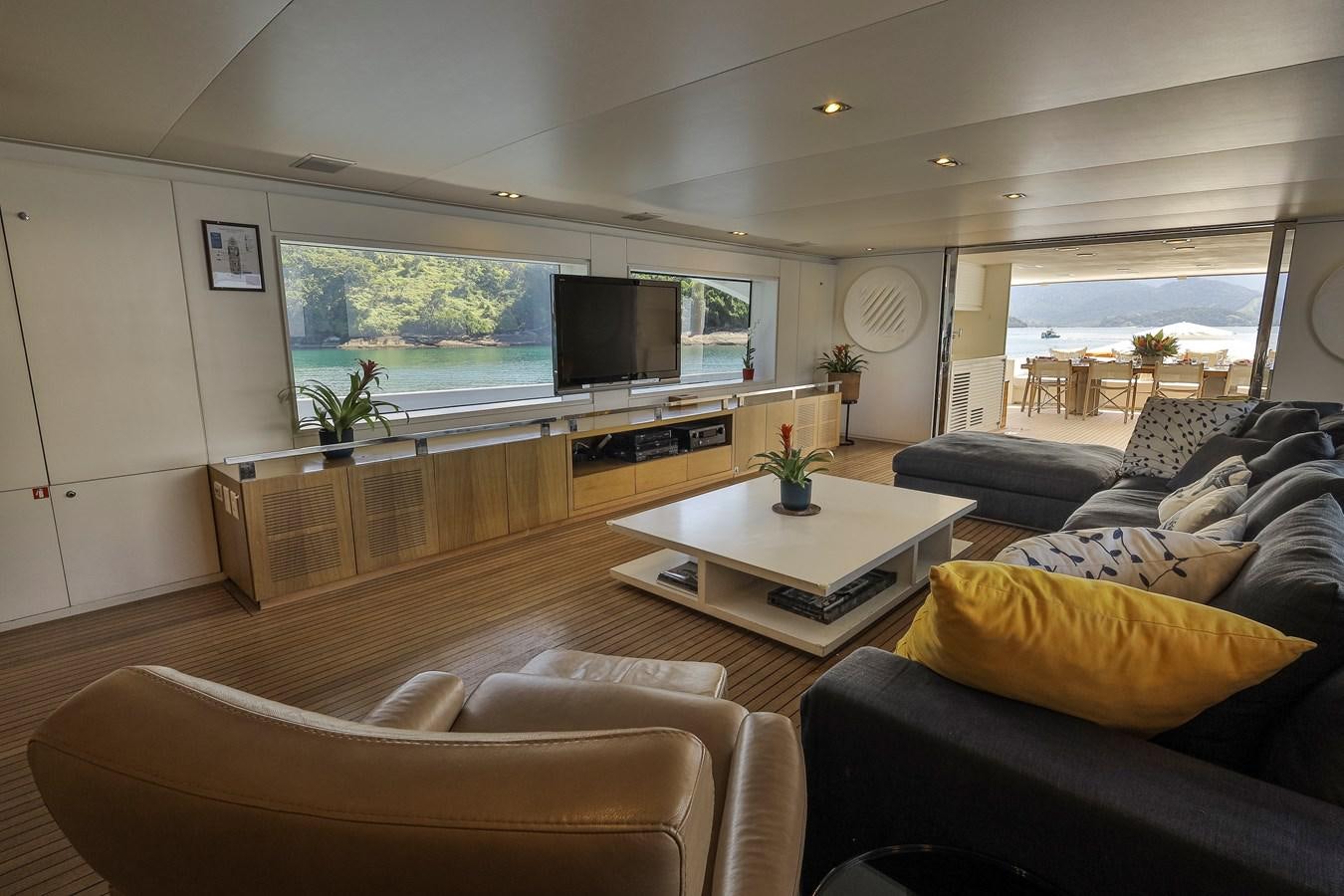 a living room with a large window aboard PAPA-GOLFE Yacht for Sale