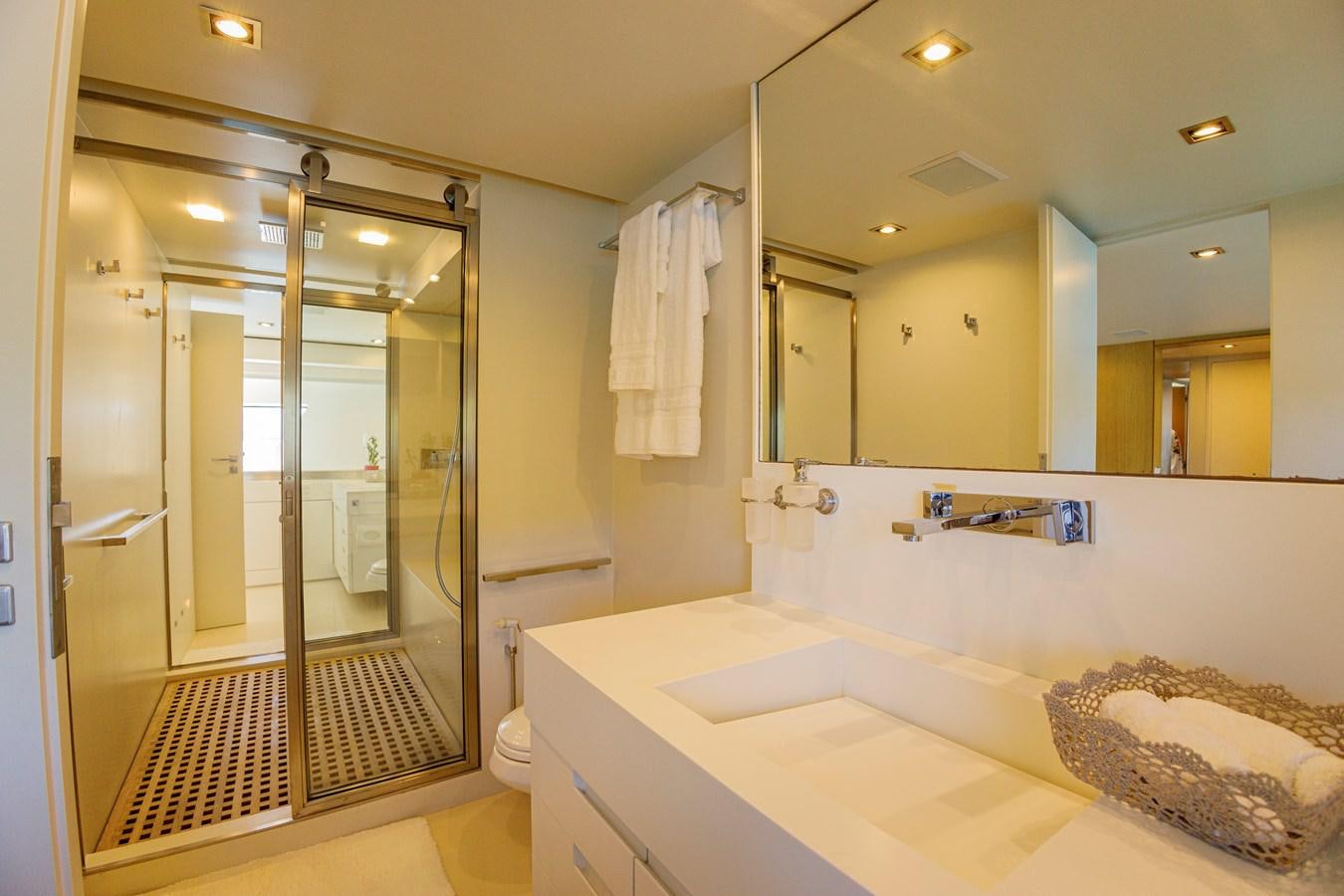 a bathroom with a large mirror aboard PAPA-GOLFE Yacht for Sale