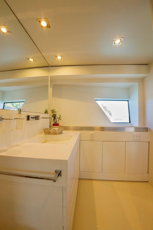 a bathroom with a sink and cabinets aboard PAPA-GOLFE Yacht for Sale