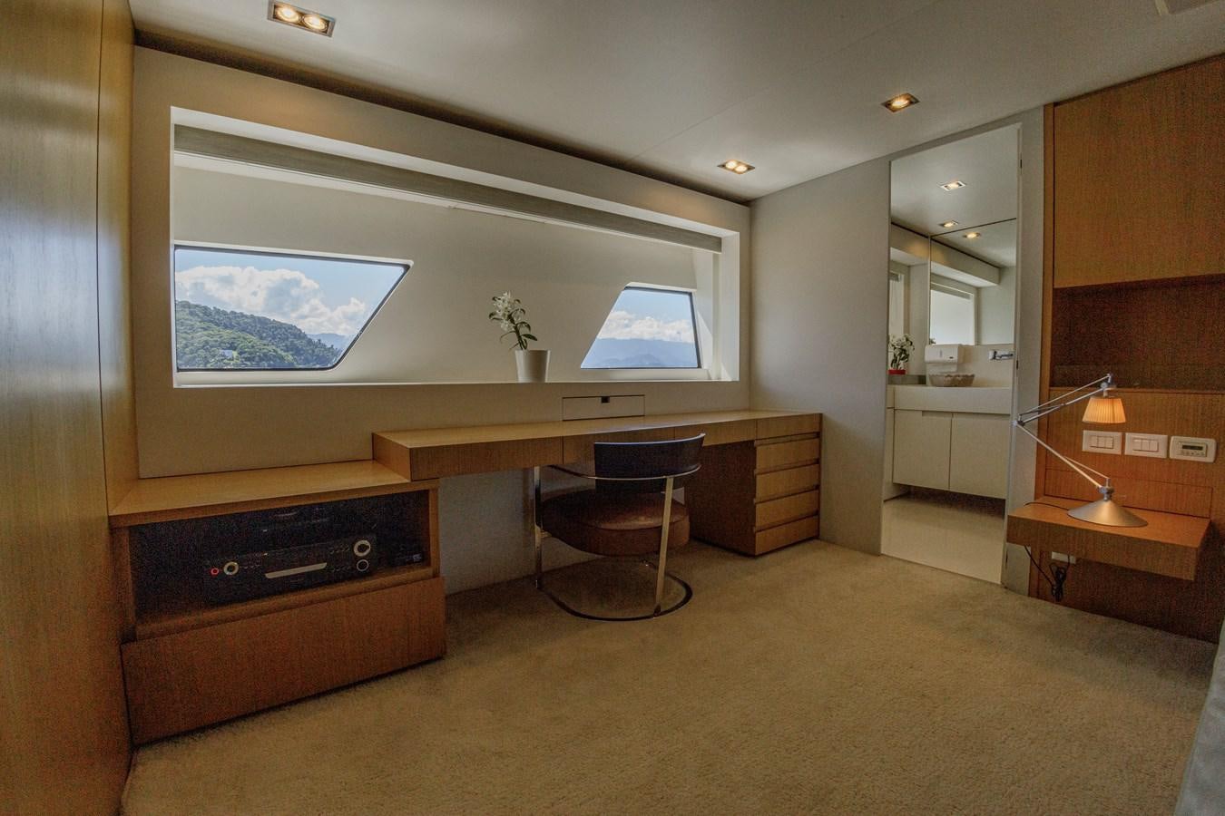 a room with a desk and a tv aboard PAPA-GOLFE Yacht for Sale