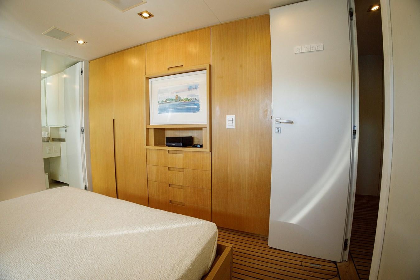 a room with a bed and a closet aboard PAPA-GOLFE Yacht for Sale