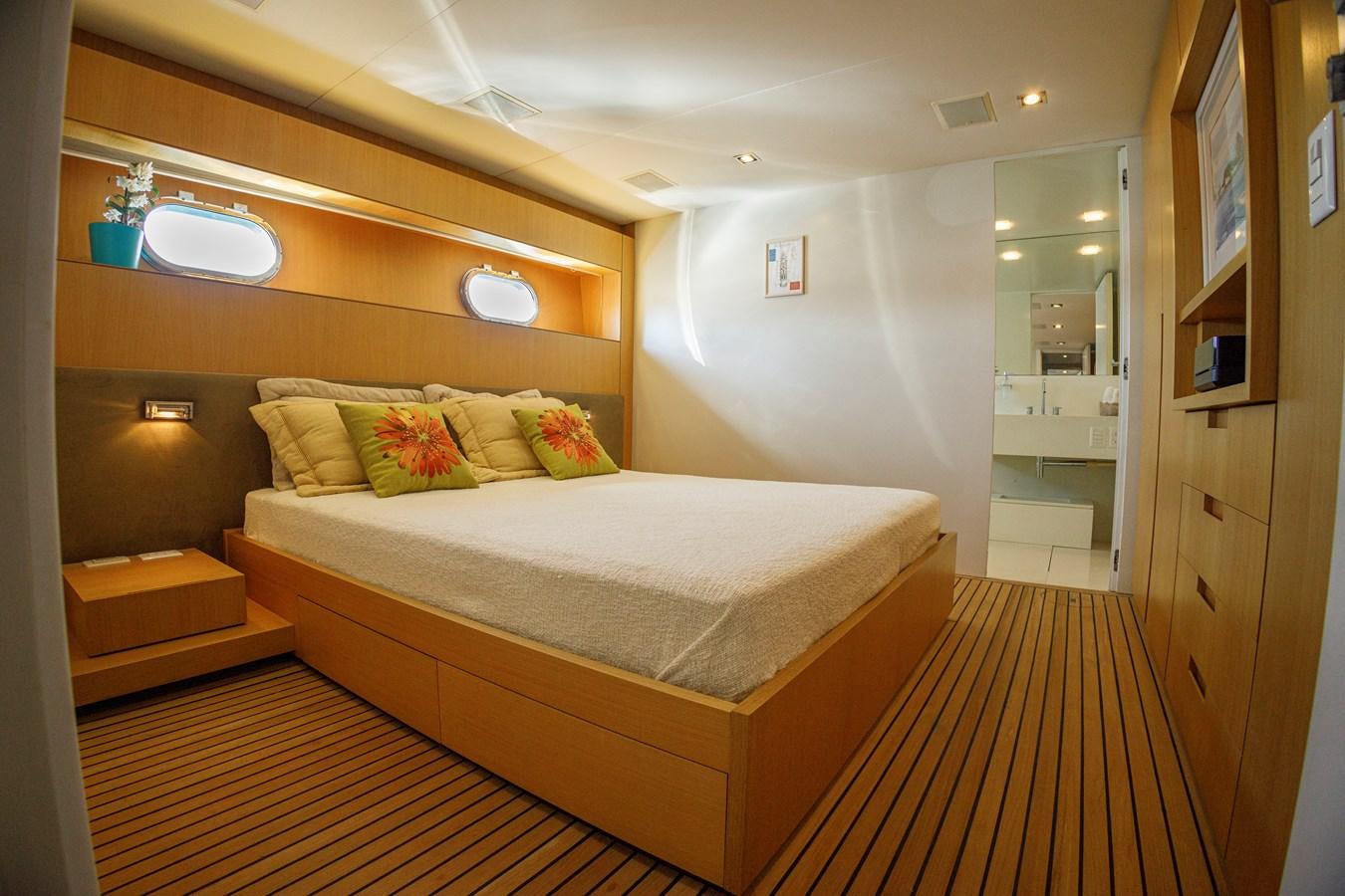 a room with a bed and a mirror aboard PAPA-GOLFE Yacht for Sale