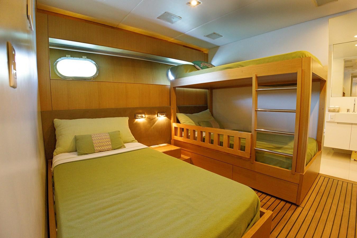 a room with a bed and a desk aboard PAPA-GOLFE Yacht for Sale