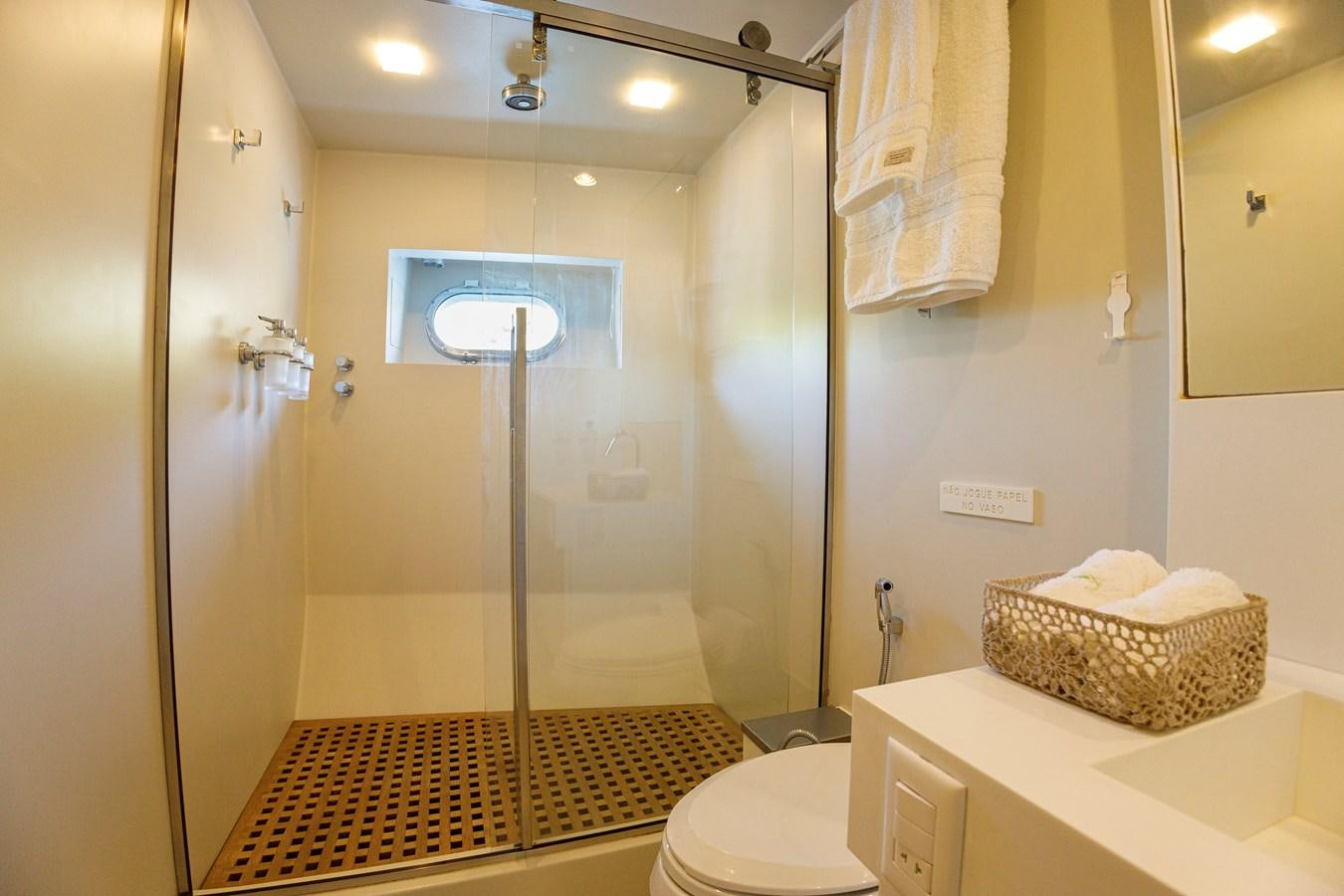 a bathroom with a shower and toilet aboard PAPA-GOLFE Yacht for Sale